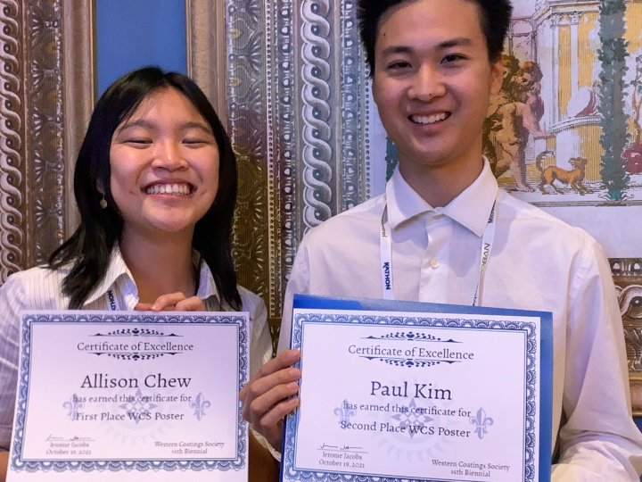 Allison Chew and Paul Kim pose with their first and second place certificates.