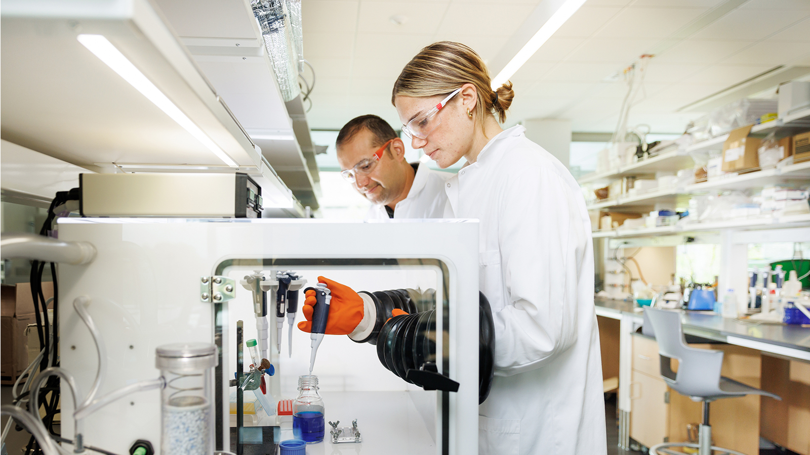 Professor and student doing research for the Center for Applications in Biotechnology