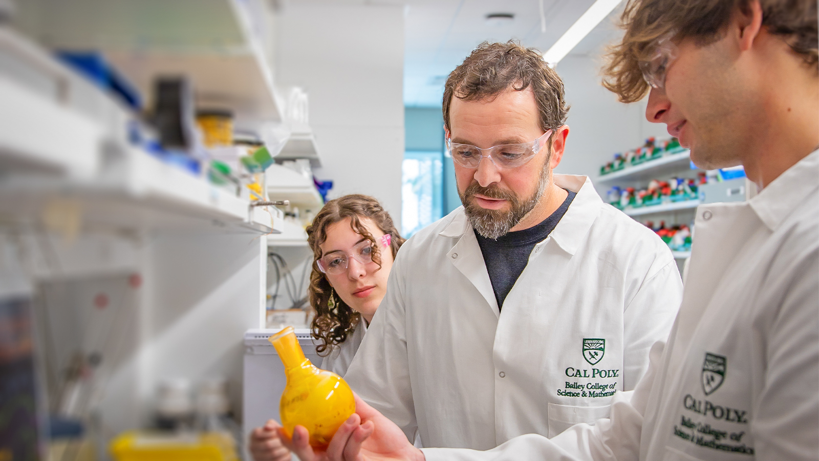 Biochemistry students and professor in lab.
