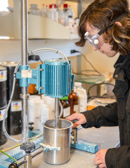Student prepares test coatings in the Western Coatings and Technology Center lab.