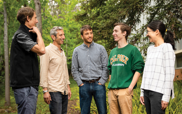 Cal Poly wind energy research team talking outdoors.
