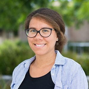 Portrait of Louise Edwards, chair of Cal Poly’s Physics Department, smiling outdoors.