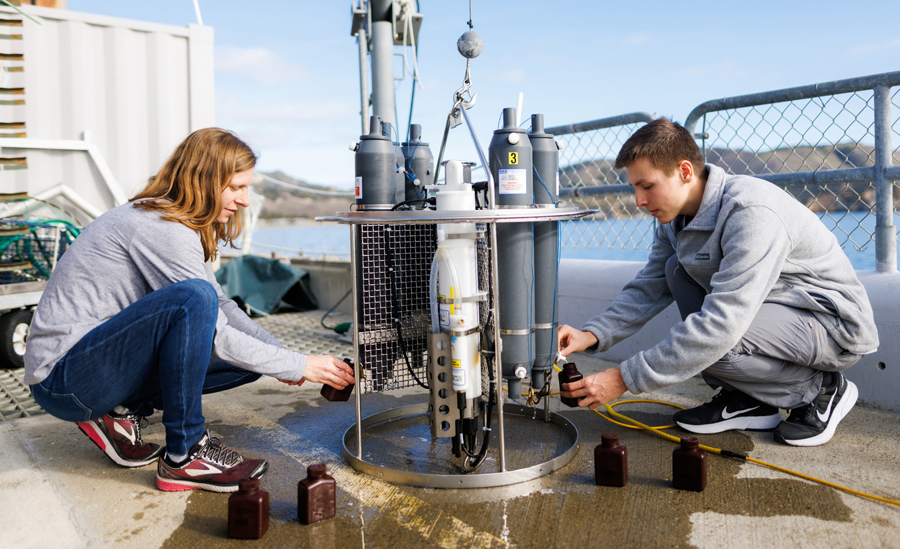 Cal Poly research professor and student take seawater samples