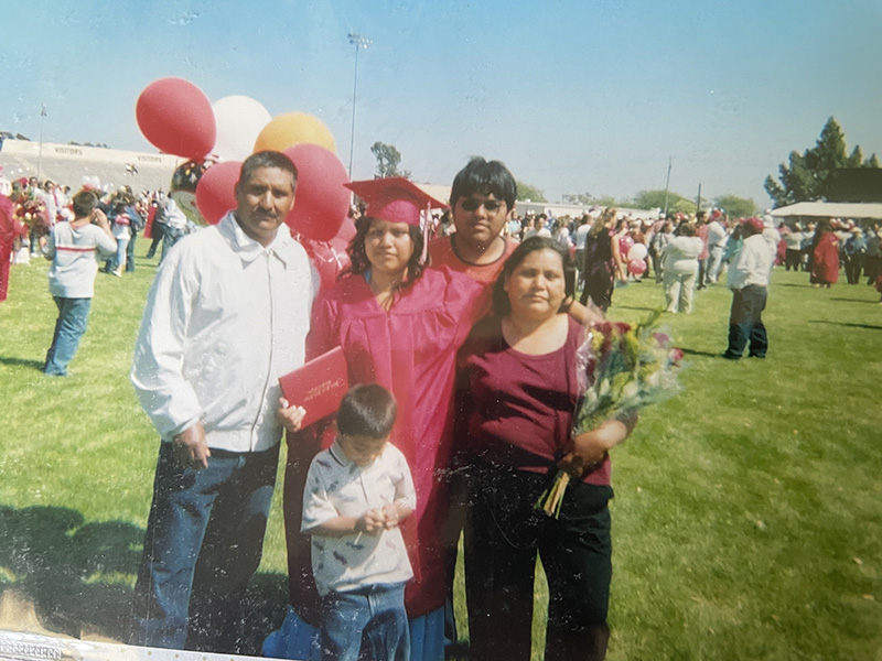 Manuela Cruz with her parents and brothers at her high school graduation.