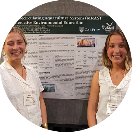Students in front of aquaculture research presentation
