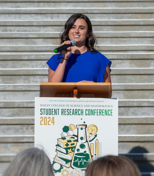 Marisa Ritchie speaking at a podium