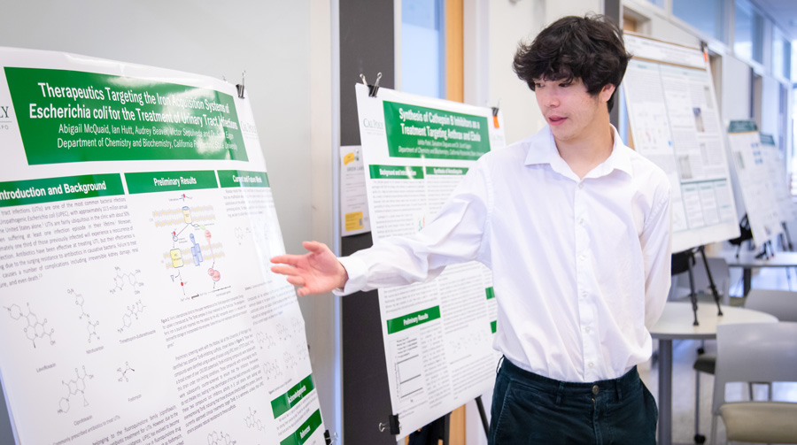 Bailey College student with research poster