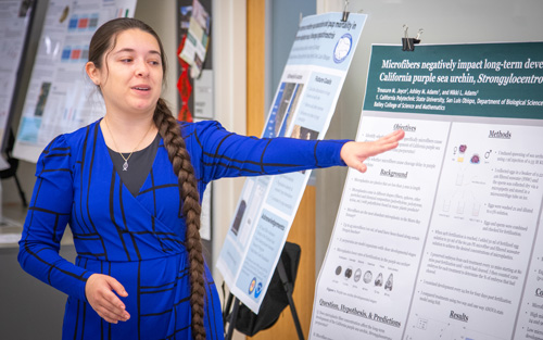 Treasure Joyce with research poster