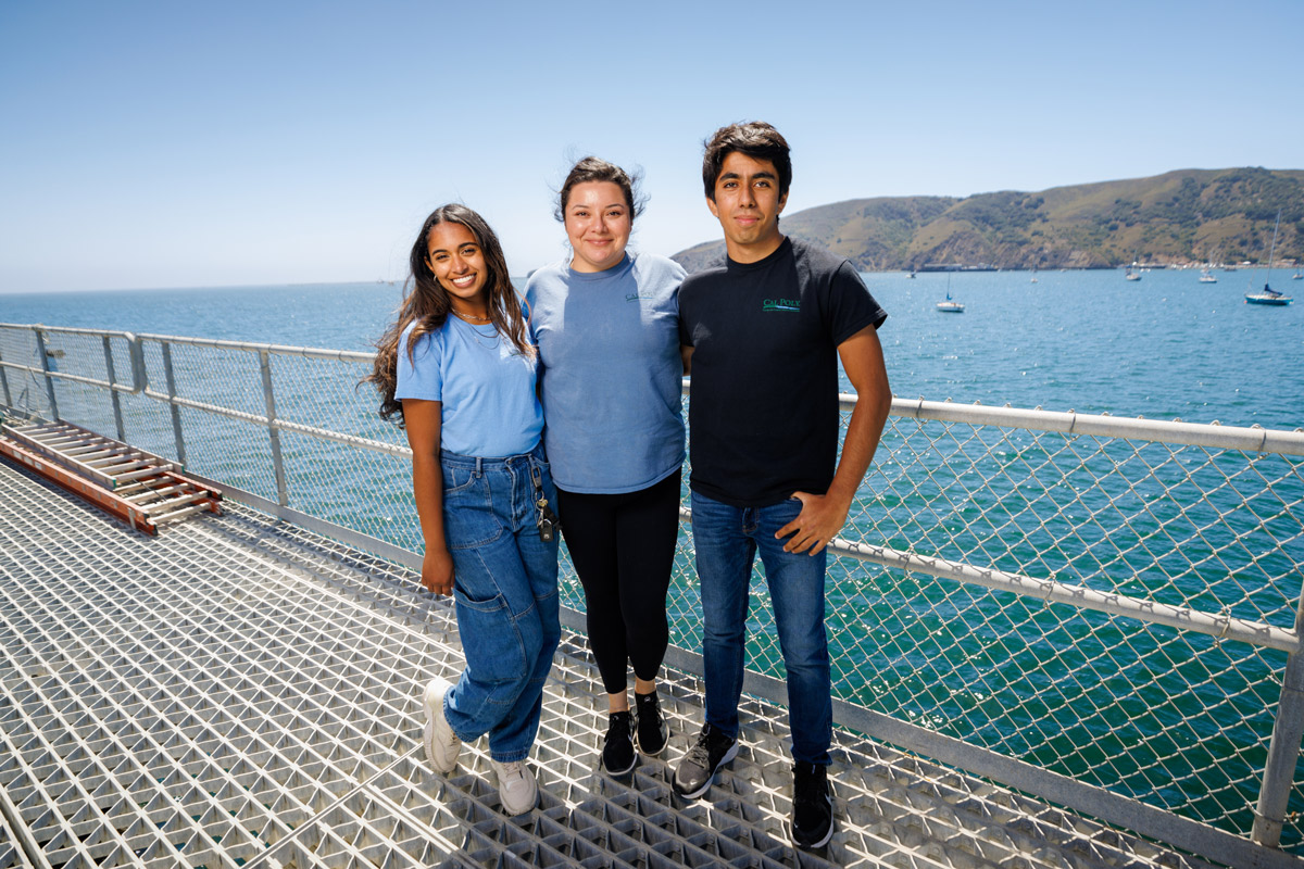 3 Bailey student ambassadors pose on the Cal Poly Pier