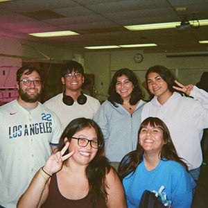 Microbiology student and ESTEEM student assistant Lucia Mendoza poses with students.