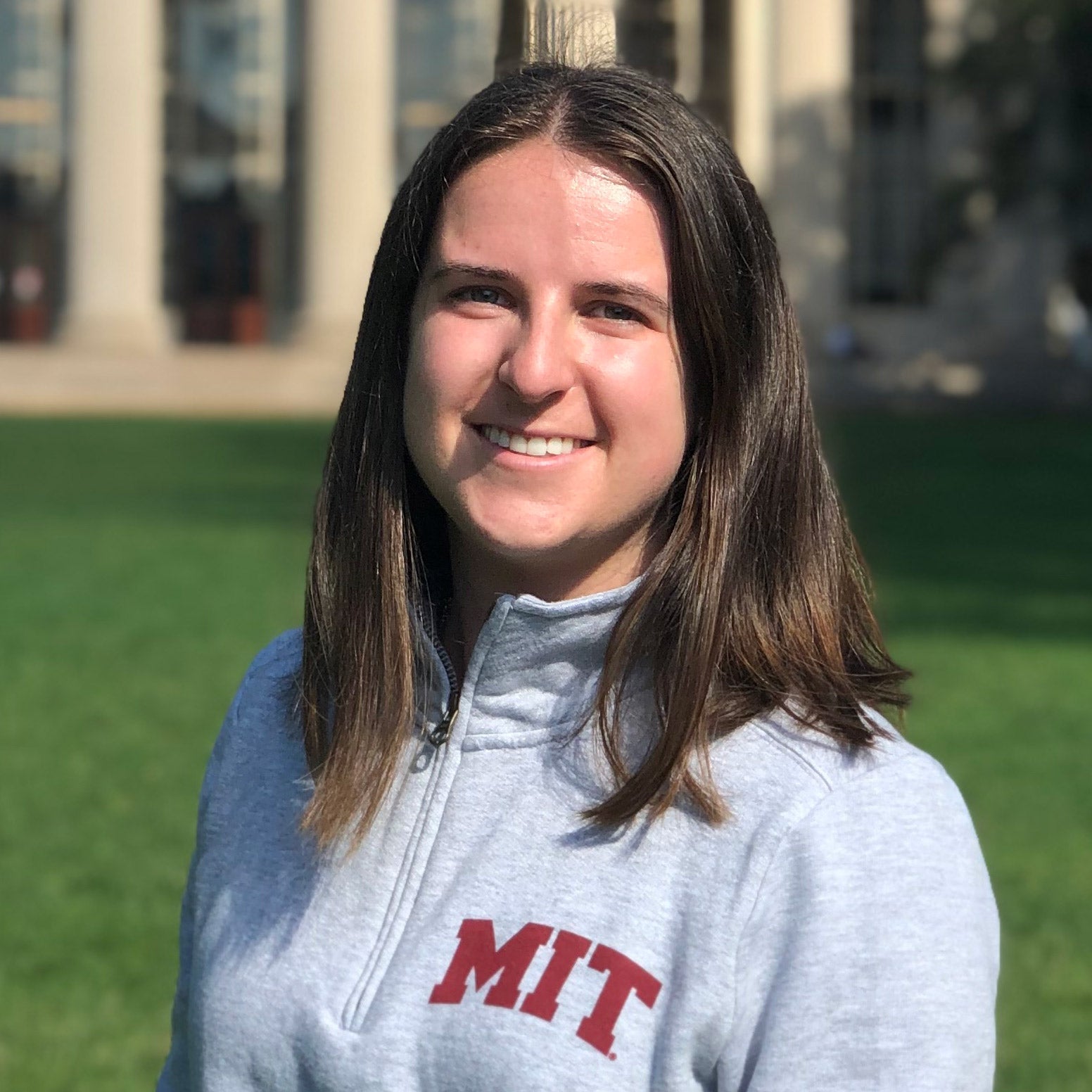 Frost Scholar alum Veera Panova poses wearing an MIT sweatshirt.