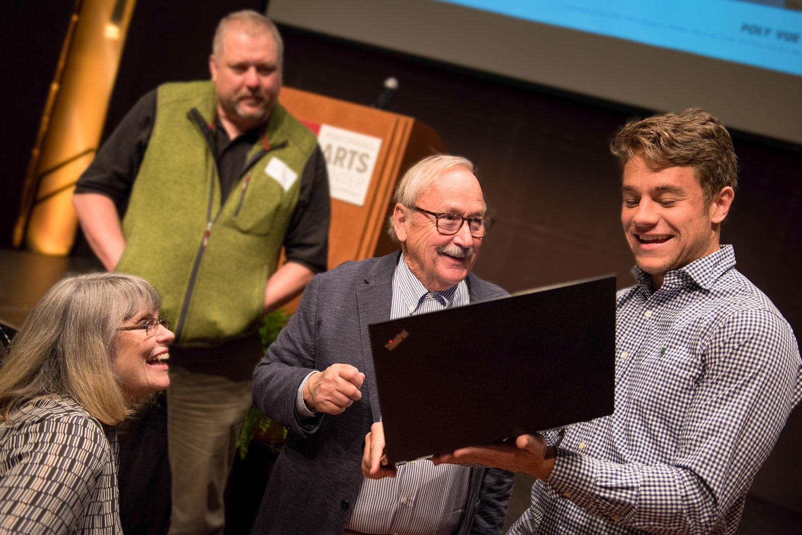 Frost Scholar alum Luc Bouchard sharing his research to Bill and Linda Frost at a Frost Scholars Luncheon in 2019.