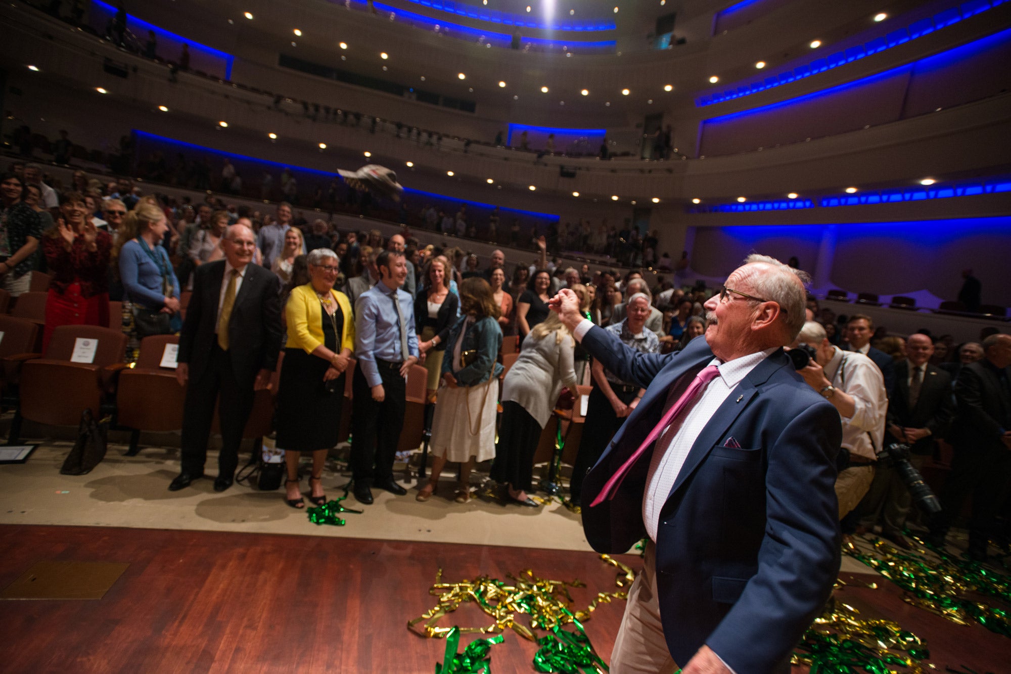 Bill Frost throws a hat into a packed audience at the Performing Arts Center during the Frost gift announcement event in 2017.