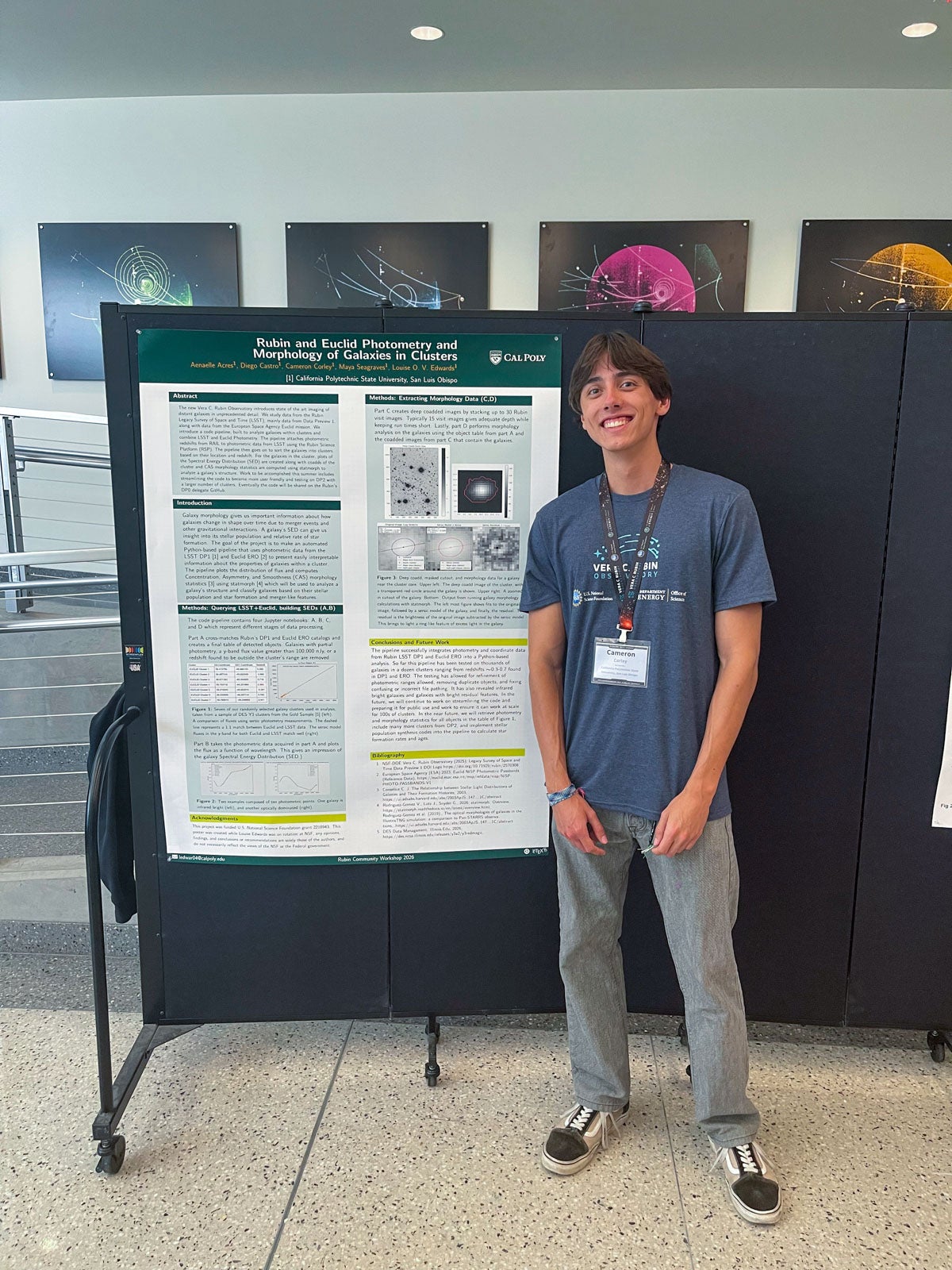 Physics student Cameron Corley stands in front of his team's Cal Poly research poster