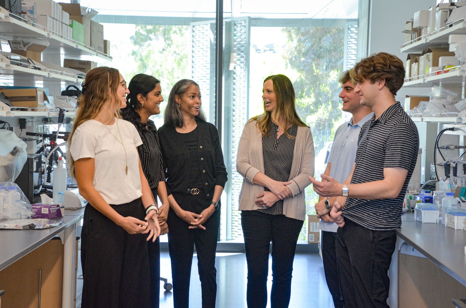 Sarepta Scholars pose with researchers from Sarepta Therapeutics in a lab