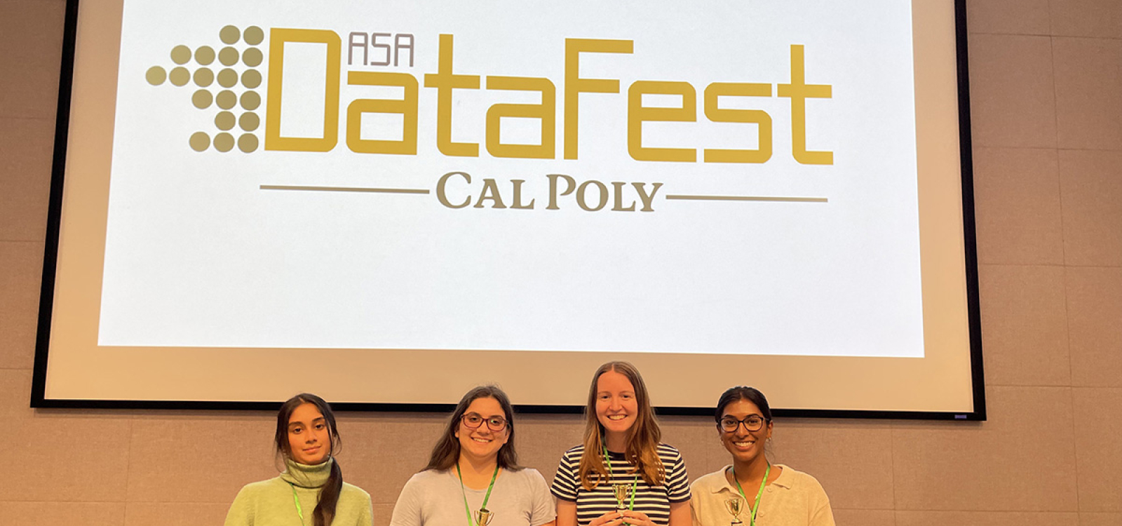 Tara Rajagopalan, Barbara Ibrahim, Charlotte Kuebitz and Kaviya Veerasingam pose with their awards after winning Best in Show at Cal Poly’s 2025 ASA DataFest.