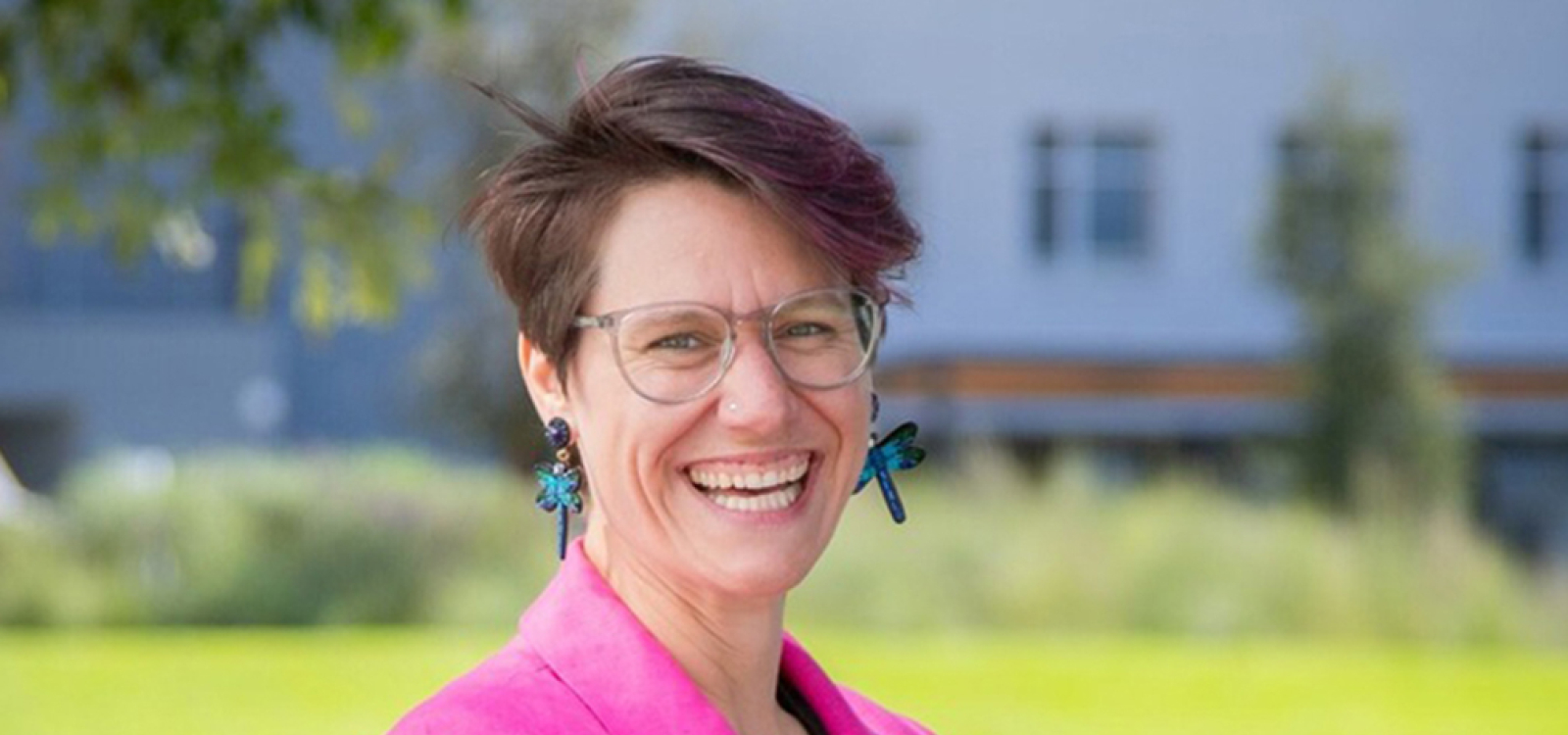 Allison Theobold, Cal Poly assistant professor of statistics, standing for a portrait outside a campus building.