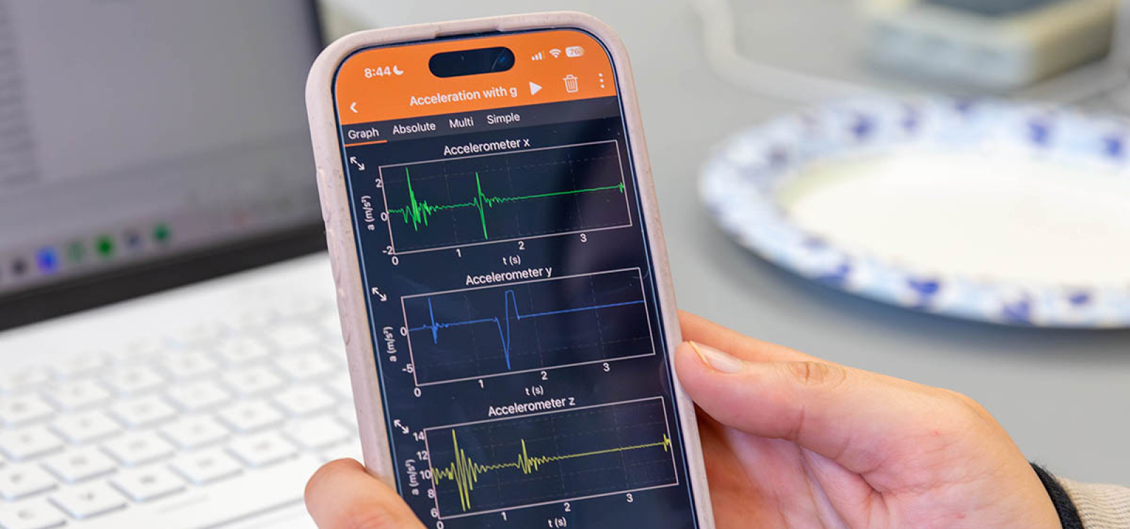 Graph of experimental data from a “Physics with Phones” activity displayed on a screen, showing plotted measurements collected from smartphone sensors during a lab experiment.