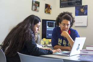 Physics Professor Louise Edwards (right) and Priscilla Holguin West (left) having a discussion.