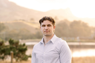 Outdoor portrait of graduate Logan Foster