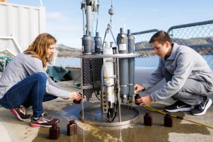 Cal Poly research professor and student take seawater samples