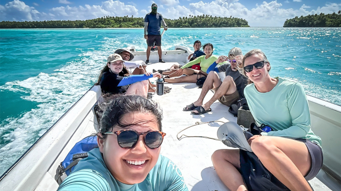 A Polynesian guide shuttles the Cal Poly marine chemistry research class back through the Tetiaroa lagoon after a day of work collecting seawater samples.