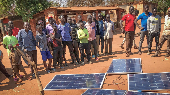 Cal Poly student researchers and international collaborators developed Insulated Solar Electric Cooking as an alternative to harmful biomass burning practices. Photo taken in Mbangombe, Malawi,  by physics Professor Pete Schwartz.