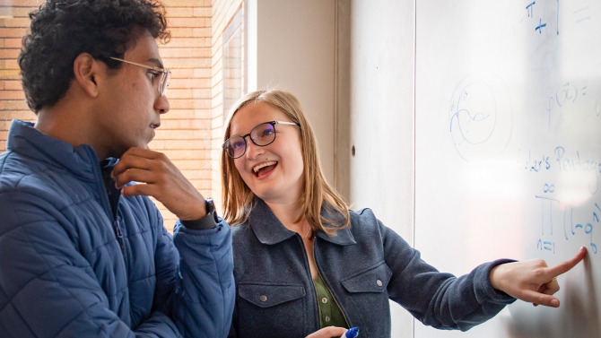 Frost Research Scholars discussing a formula.