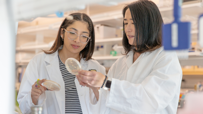Cal Poly student and professor doing research in a lab.