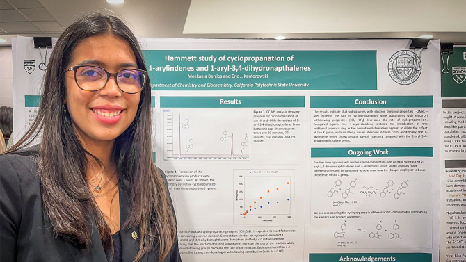Chemistry student Meekaela Berrios presenting her research poster.