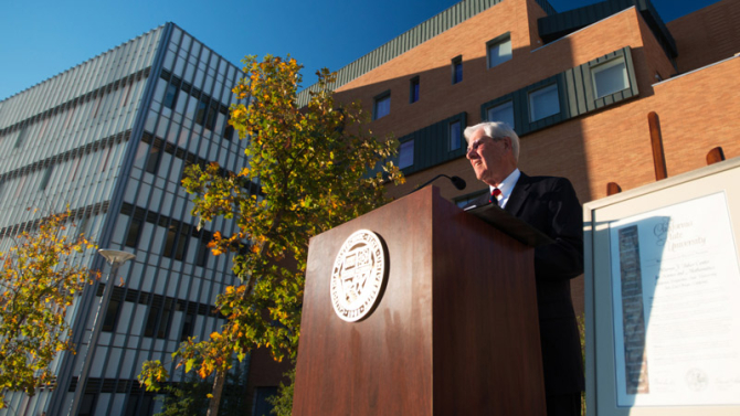 Warren J. Baker speaking at dedication ceremony