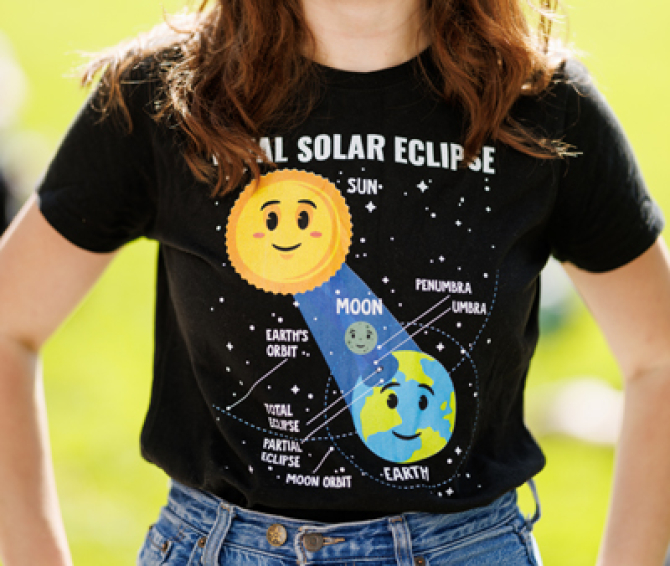 Cal Poly student wearing a solar eclipse themed tee shirt