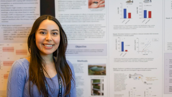 Biological sciecnes graduate student Isabel Villafuentes presenting her research poster.
