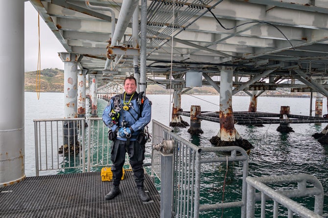 Connor Healy poses at the Cal Poly Pier