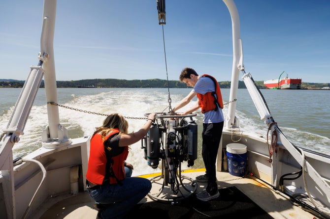 Oceanography students Mario Matteoli and Gianna Chacon, aboard the research vessel Questuary, work to complete weekly surveys of the phytoplankton spring bloom in the San Francisco Estuary in 2026.